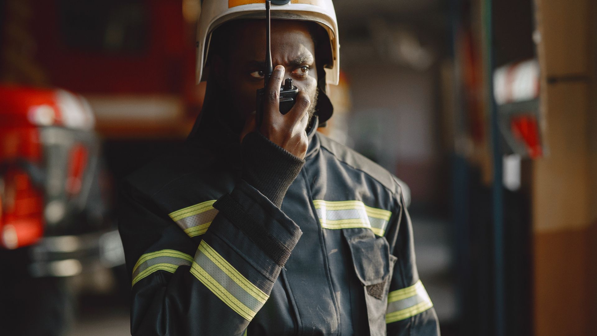 a firefighter using a walkie talkie