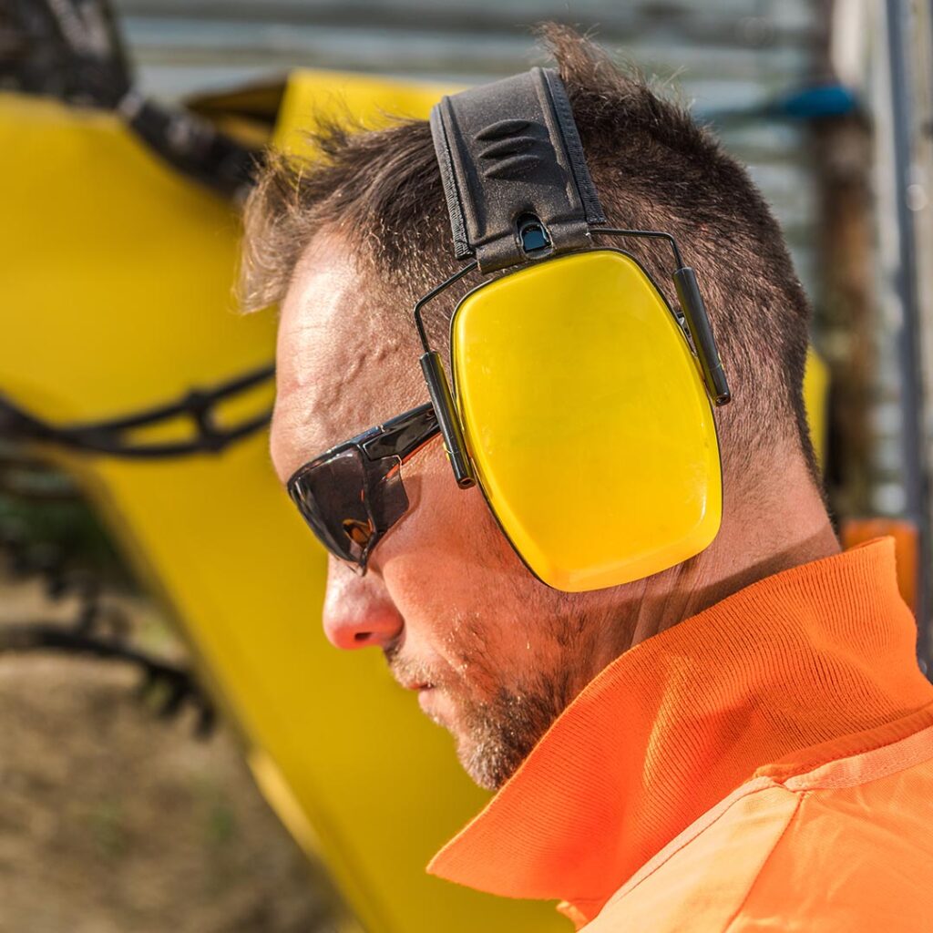 Construction worker wearing a noise cancelling headset
