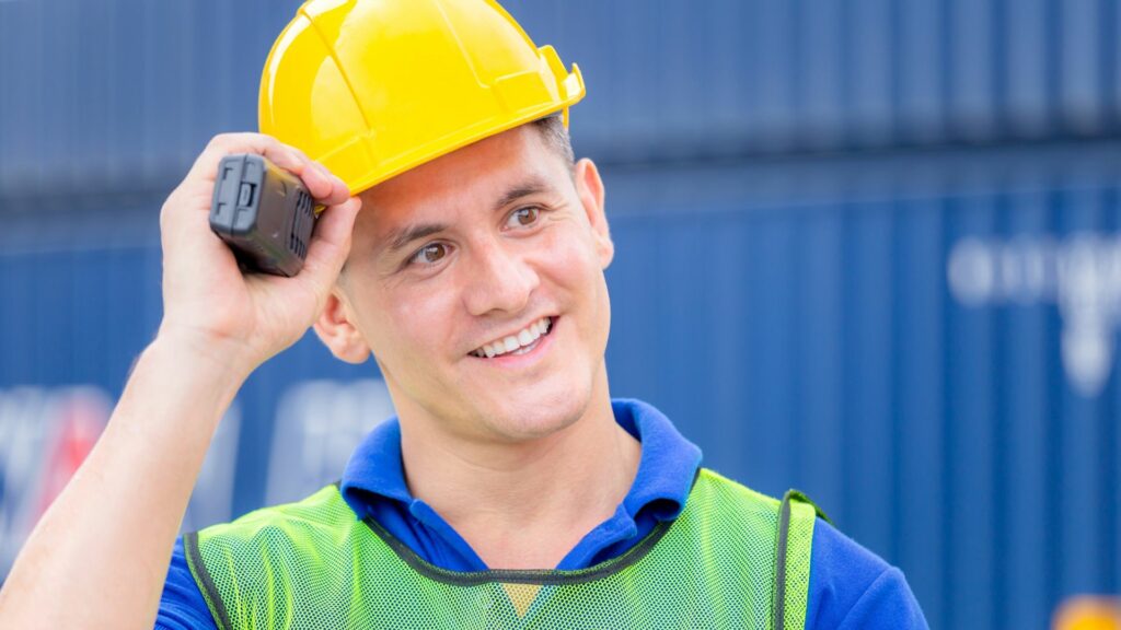 image of a construction worker with hardhat and radio