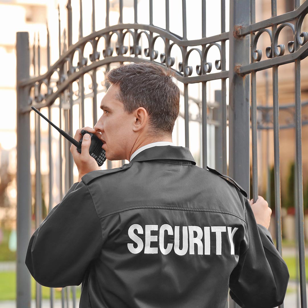 security officer talking into a radio