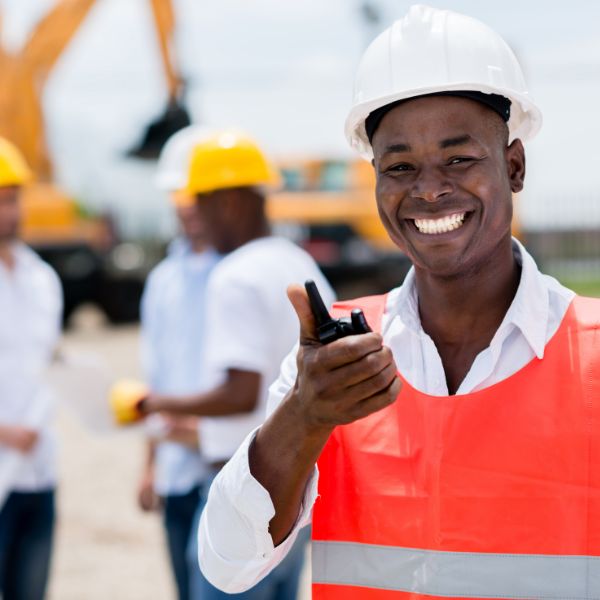 Construction workers holding a radio