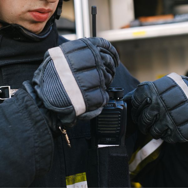 A police officer messing with a radio