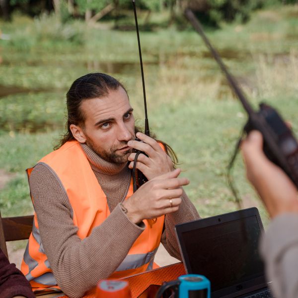 A park ranger using a walkie talkie
